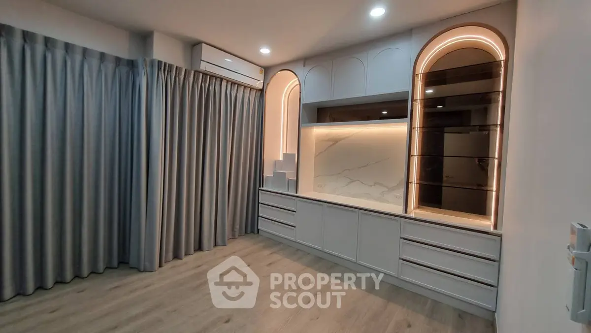 Modern living room with elegant built-in storage and ambient lighting