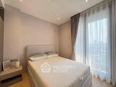 Modern bedroom with large window and city view, featuring a cozy bed and minimalist decor.
