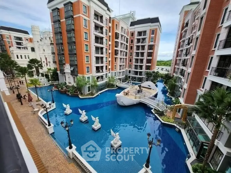 Luxurious residential complex with stunning pool and elegant architecture.