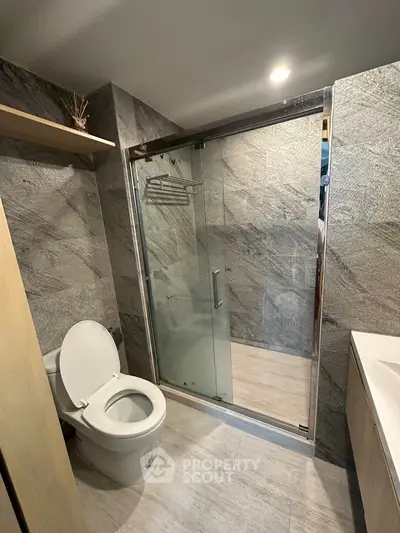 Modern bathroom with sleek shower and stone tile design