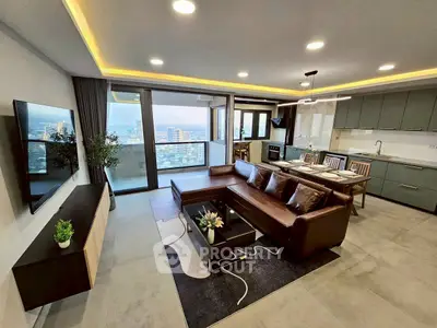 Modern open-plan living room with stunning city view and elegant furnishings.