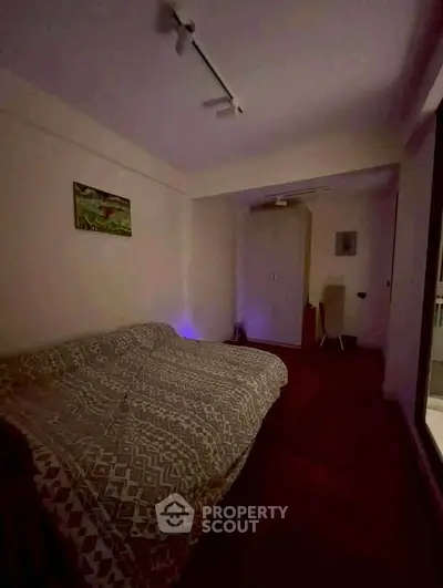 Cozy bedroom with modern lighting and stylish decor