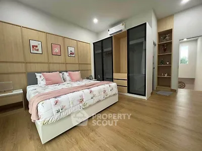 Spacious modern bedroom with elegant decor and ample storage space
