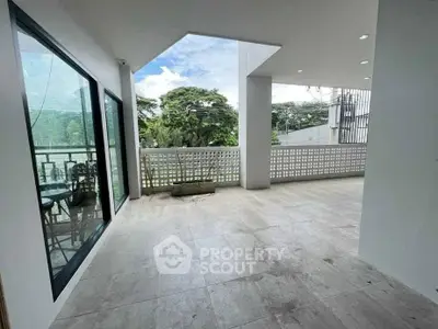 Spacious balcony with scenic view and modern design, perfect for relaxation and outdoor gatherings.