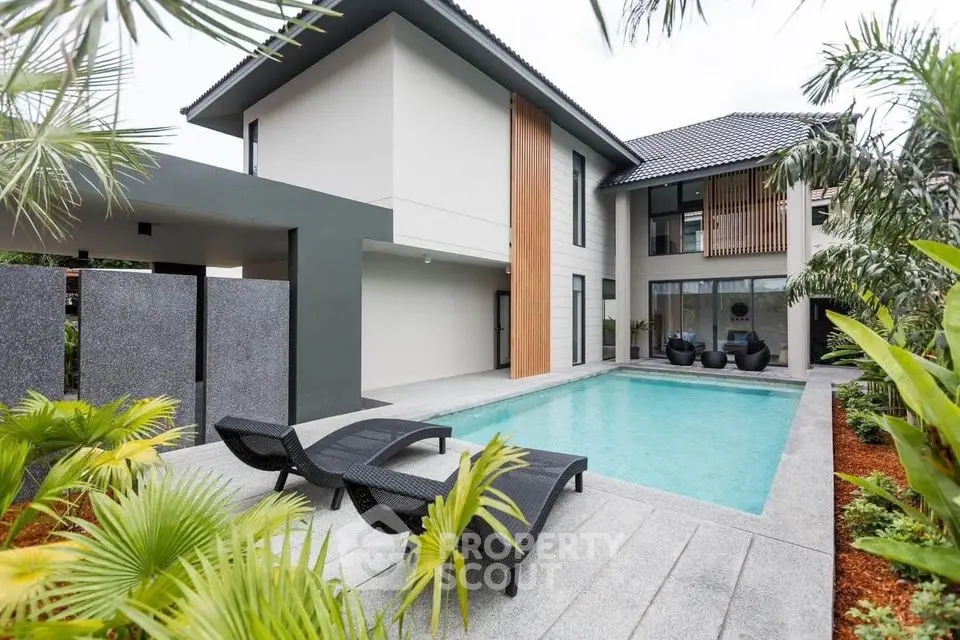 Luxurious modern home with private pool and lush garden