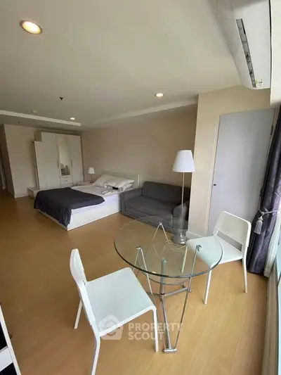 Spacious studio apartment with modern furnishings and natural light