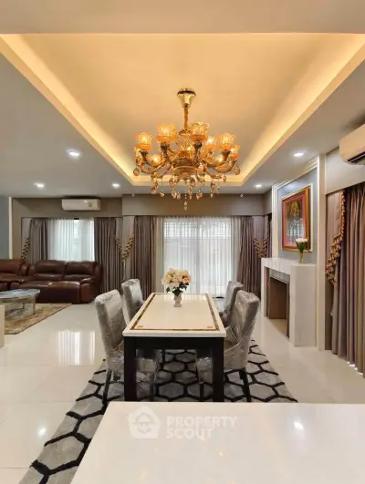 Luxurious living room with elegant chandelier and modern decor