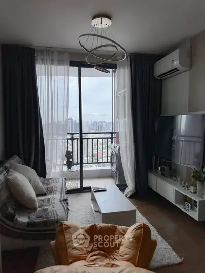 Modern living room with city view, stylish decor, and balcony access in high-rise apartment.