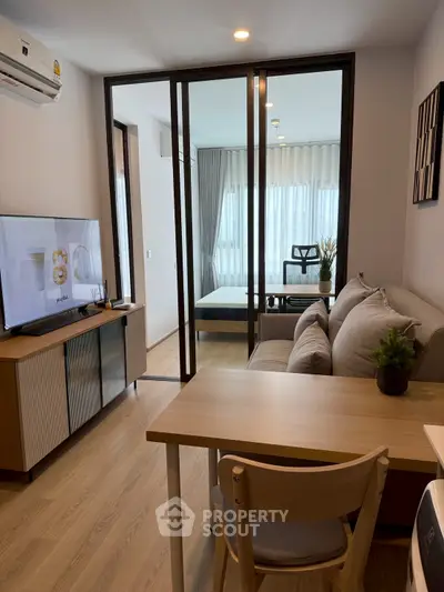 Modern living room with open layout and stylish furniture in a cozy apartment.