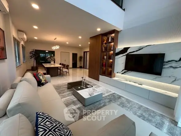 Luxurious modern living room with elegant decor and open kitchen layout