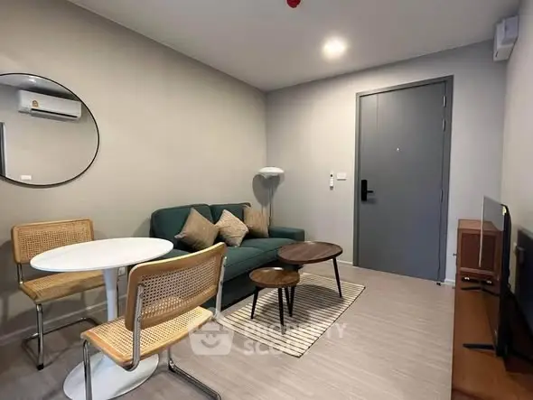 Modern living room with stylish furniture and neutral tones, perfect for cozy gatherings.