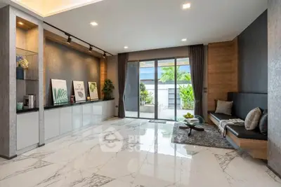 Spacious modern living room with elegant marble flooring and stylish decor