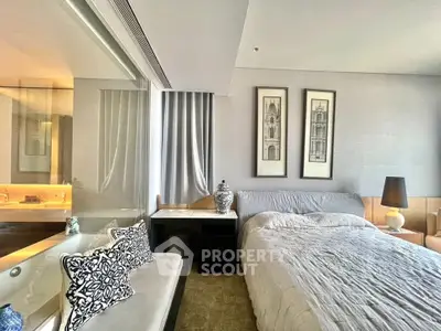 Luxurious bedroom with elegant decor and cozy ambiance in modern apartment.