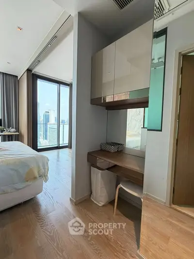 Luxurious bedroom with city view and modern decor in high-rise apartment