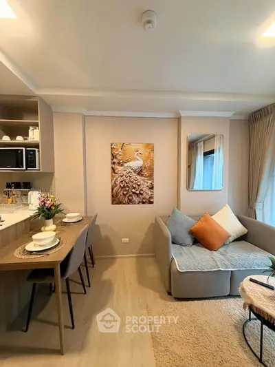 Cozy living room with modern decor and open kitchen layout