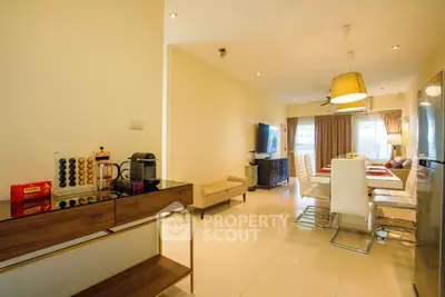 Spacious modern living and dining area with elegant decor and natural light.