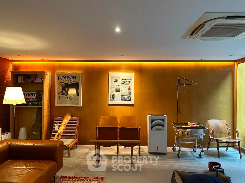 Stylish living room with modern furniture and warm lighting, perfect for relaxation and entertainment.