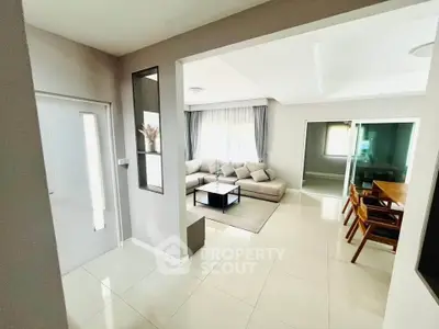 Spacious modern living room with elegant decor and dining area