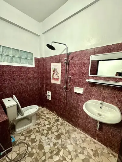 Spacious bathroom with modern fixtures and stylish tile design