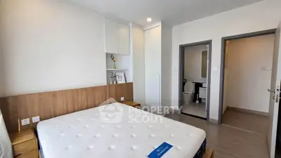 Modern bedroom with ensuite bathroom in a stylish apartment