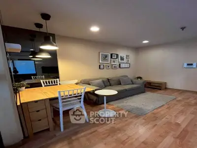 Cozy living room with stylish decor and wooden flooring