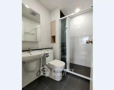 Modern bathroom with sleek shower and elegant fixtures