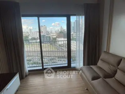 Modern apartment with city view from spacious living room balcony.