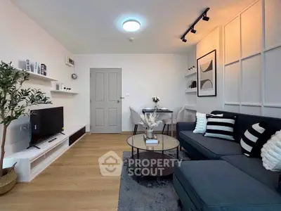 Modern living room with stylish decor, cozy seating, and sleek furniture, perfect for relaxation and entertainment.