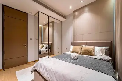 Modern bedroom with mirrored closet and elegant decor