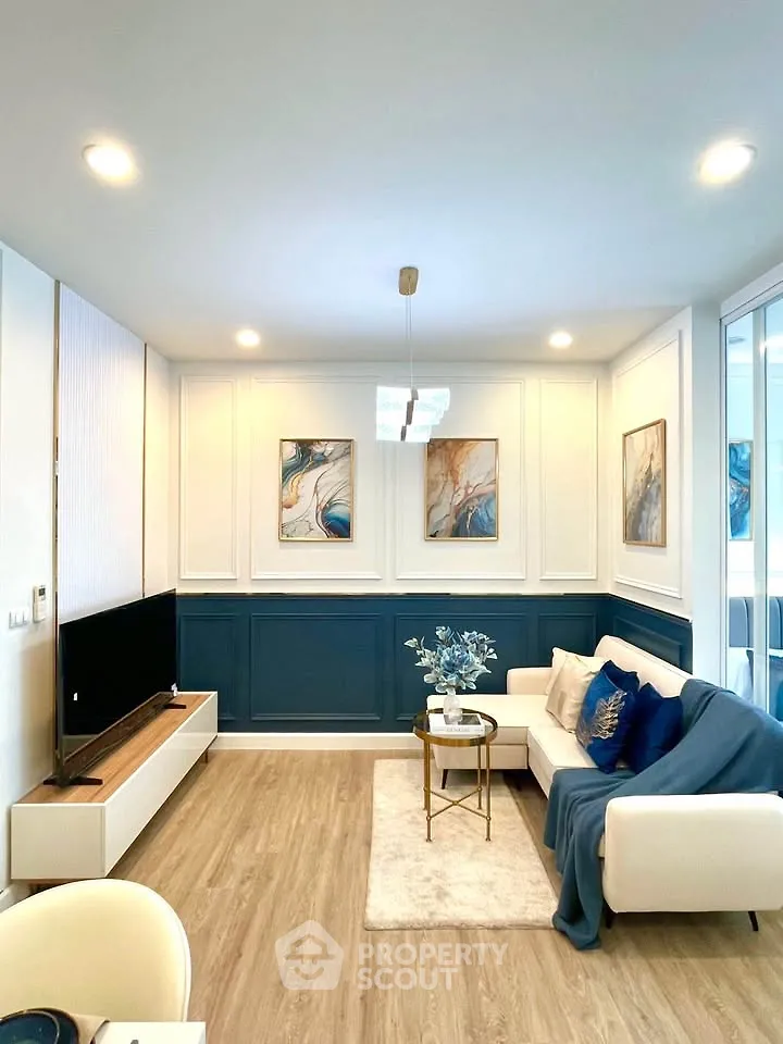 Stylish modern living room with elegant decor and cozy seating area.