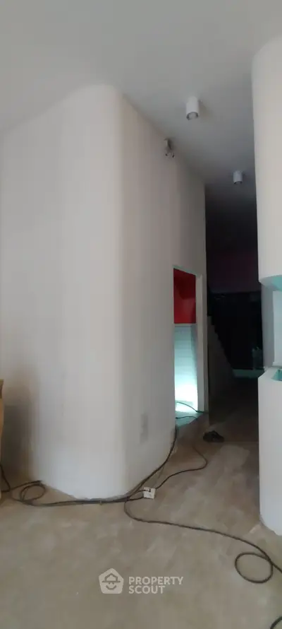 Spacious interior with modern design and unique architectural features.