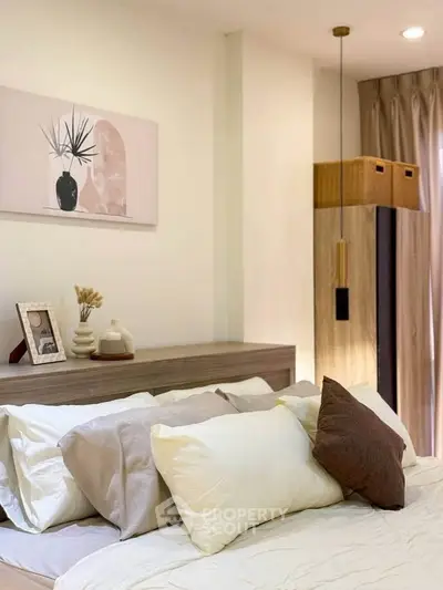 Cozy bedroom with stylish decor and soft lighting, perfect for relaxation.