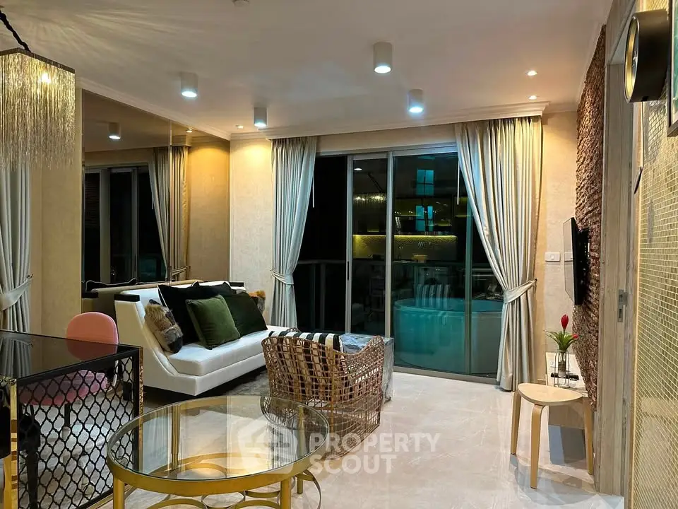 Luxurious modern living room with elegant decor and large windows for natural light.