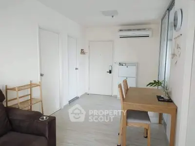 Modern living room with minimalist decor and air conditioning