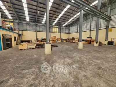 Spacious industrial warehouse with high ceilings and ample storage space.
