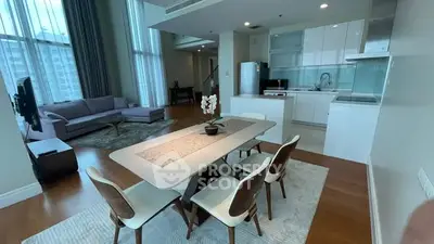 Spacious modern living room with open kitchen and elegant dining area