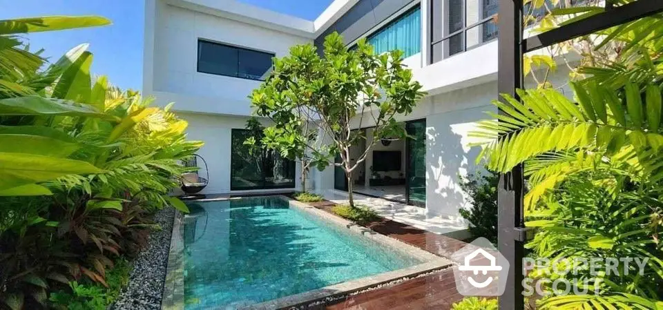 Luxurious modern villa with private pool and lush garden, perfect for serene living.