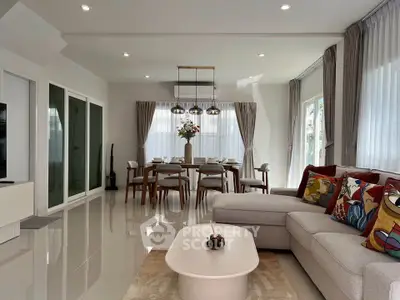 Spacious modern living room with elegant dining area and stylish decor