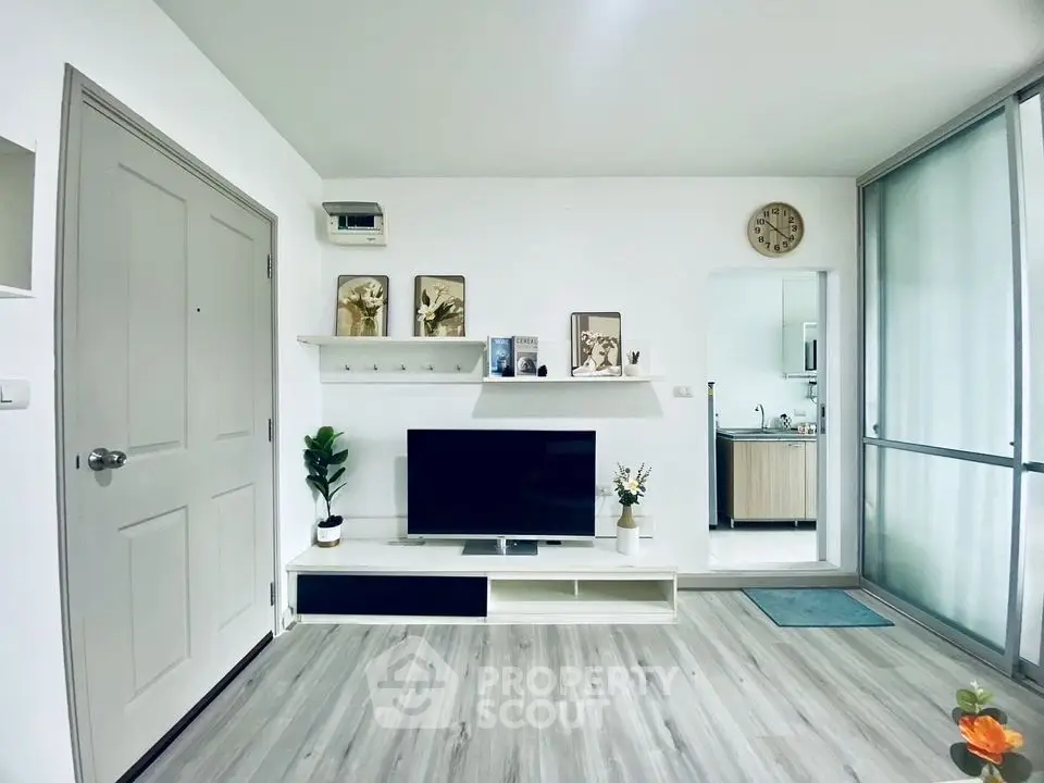 Modern living room with sleek decor and open kitchen layout