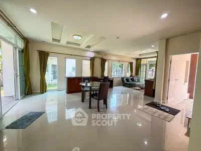 Spacious living room with modern design and large windows for natural light