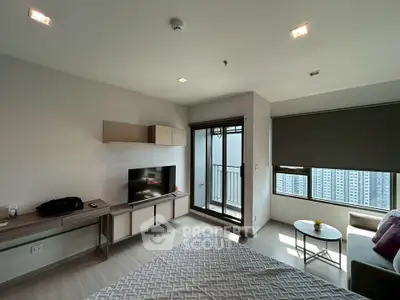 Modern living room with balcony and city view in high-rise apartment