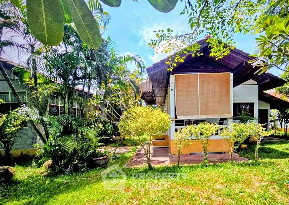 Charming tropical bungalow with lush garden and vibrant greenery