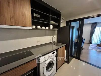 Modern kitchen with sleek appliances and open layout design