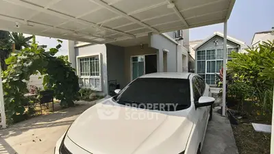 Charming suburban home with carport and lush garden, perfect for family living.