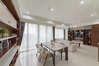 Spacious modern living room with elegant dining area and large windows.