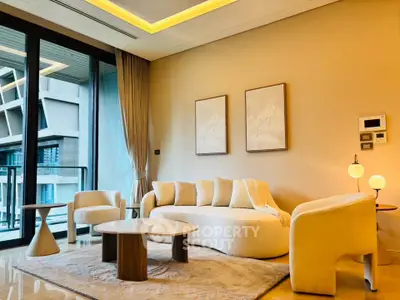 Luxurious modern living room with elegant furniture and large windows offering a stunning view.