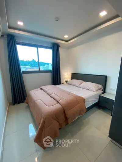 Modern bedroom with large window and stylish decor