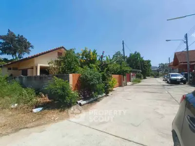 Charming suburban street with cozy homes and lush greenery, perfect for tranquil living.