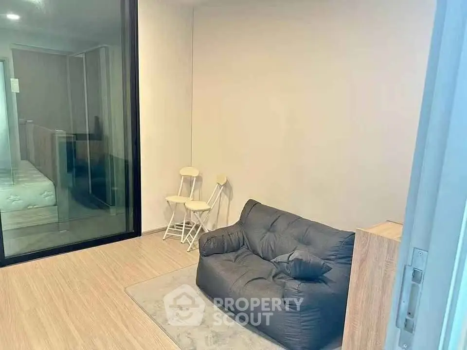 Cozy modern living room with plush seating and minimalist decor, perfect for relaxation.