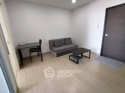 Modern minimalist living room with sleek furniture and wooden flooring